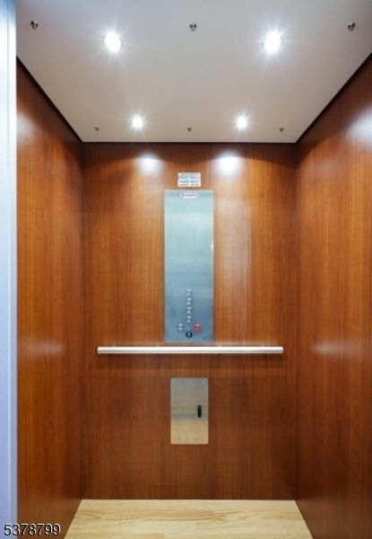 Elevator, Interior, Recessed Lighting, Wood Texture Flooring, Wooden Walls