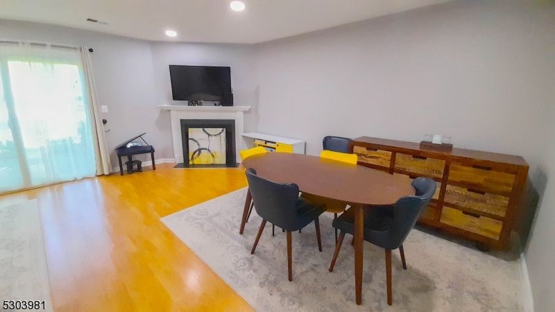 Dining room, Fireplace, Interior, Recessed Lighting, Wood Texture Flooring
