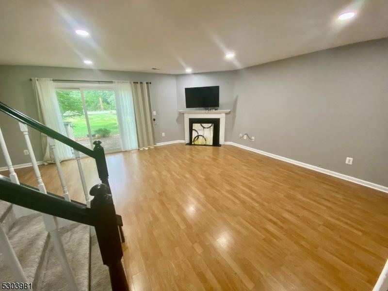 Empty room, Fireplace, Interior, Recessed Lighting, Wood Texture Flooring