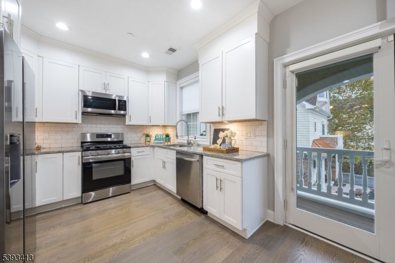 Interior, Kitchen, Recessed Lighting, Stainless Steel Appliances, Wood Texture Flooring