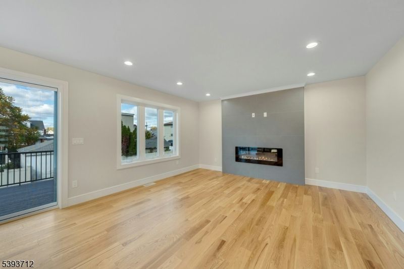Empty room, Fireplace, Interior, Recessed Lighting, Wood Texture Flooring