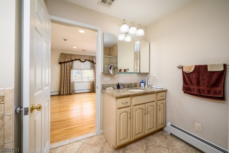 Bathroom, Dual Sink Vanities, Interior, Recessed Lighting, Wood Texture Flooring