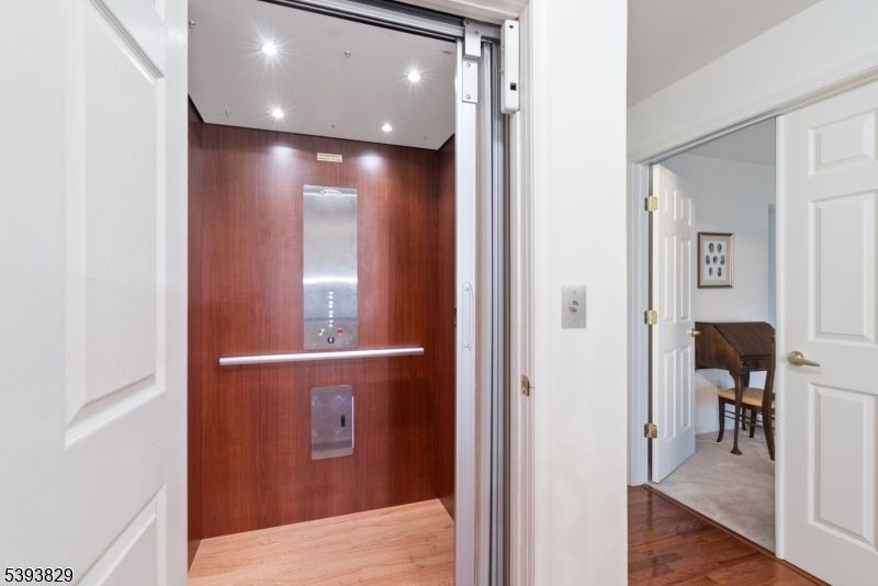 Elevator, Interior, Recessed Lighting, Wood Texture Flooring, Wooden Walls