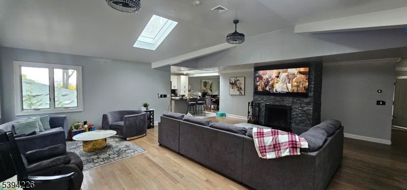Dining room, Fireplace, Interior, Living room, Pendant Lights, Recessed Lighting, Wood Texture Flooring