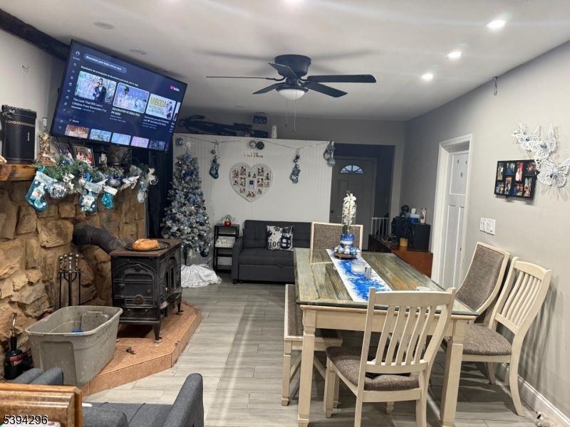 Dining room, Fireplace, Interior, Living room, Recessed Lighting, Wood Texture Flooring