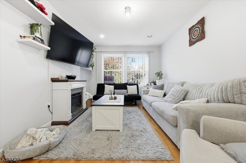 Fireplace, Interior, Living room, Recessed Lighting, Wood Texture Flooring