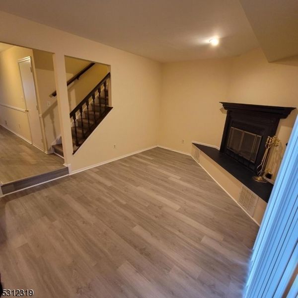 Empty room, Fireplace, Interior, Recessed Lighting, Wood Texture Flooring