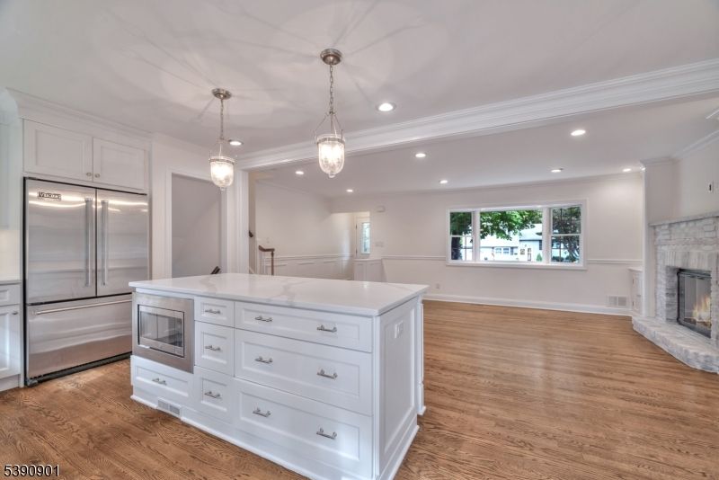 Fireplace, Interior, Kitchen, Pendant Lights, Recessed Lighting, Stainless Steel Appliances, Wood Texture Flooring