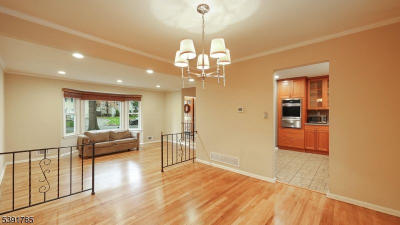 Chandelier, Interior, Kitchen, Recessed Lighting, Stainless Steel Appliances, Wood Texture Flooring