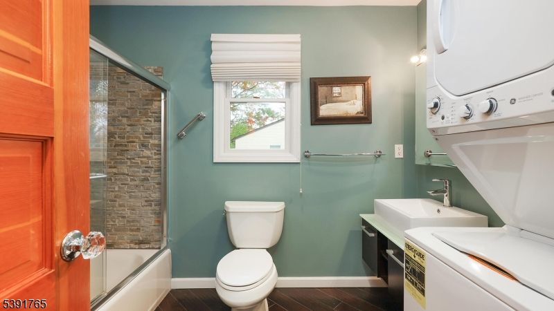 Bathroom, Glass Shower, Interior, Washer, Wood Texture Flooring