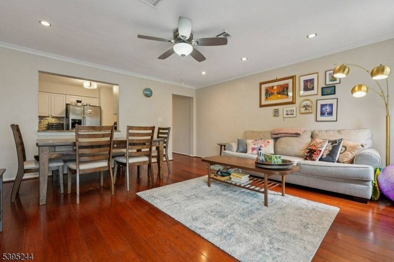 Dining room, Interior, Kitchen, Living room, Recessed Lighting, Stainless Steel Appliances, Wood Texture Flooring