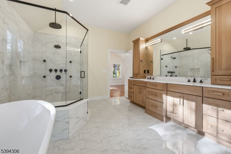 Bathroom, Dual Sink Vanities, Free Standing Baths, Glass Shower, Interior, Marble, Marble Walls, Recessed Lighting