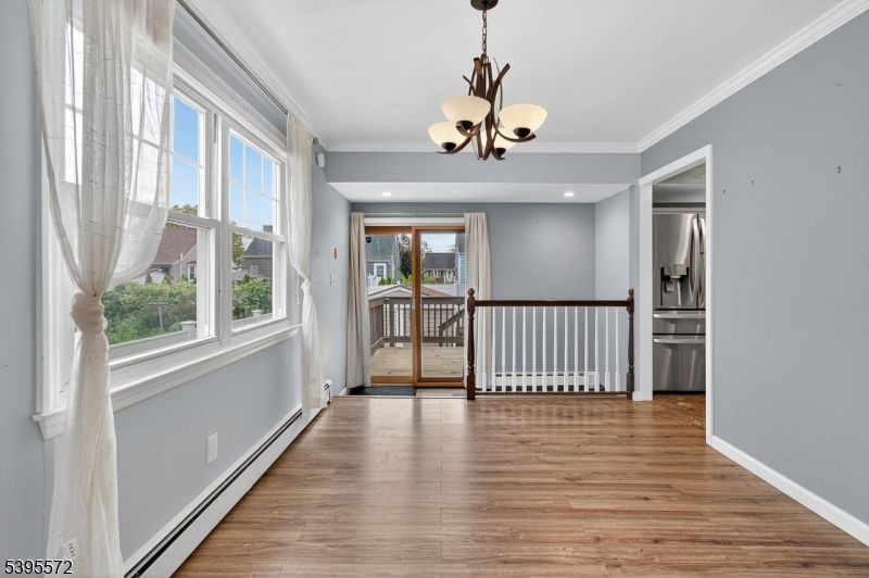 Chandelier, Empty room, Interior, Pendant Lights, Recessed Lighting, Stainless Steel Appliances, Wood Texture Flooring