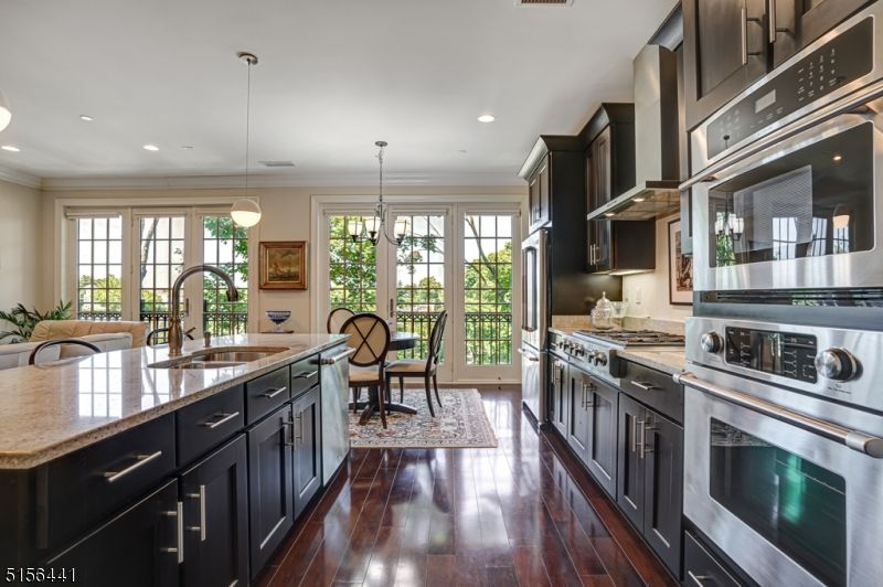Chandelier, Dining room, Interior, Kitchen, Pendant Lights, Recessed Lighting, Stainless Steel Appliances, Wood Texture Flooring
