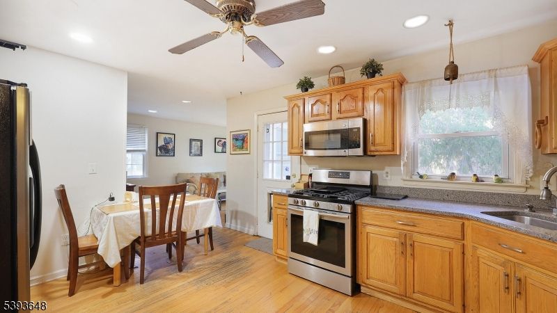 Dining room, Interior, Kitchen, Recessed Lighting, Stainless Steel Appliances, Wood Texture Flooring