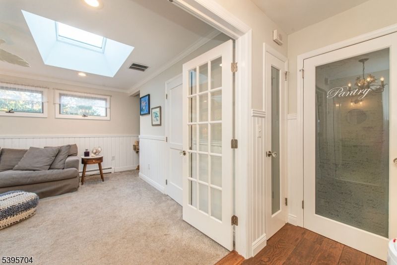 Bathroom, Chandelier, Glass Shower, Interior, Recessed Lighting, Wood Texture Flooring