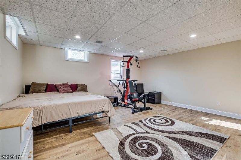 Bedroom, Fitness Equipment, Interior, Recessed Lighting, Wood Texture Flooring