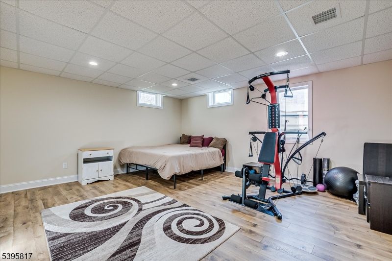 Bedroom, Fitness Equipment, Interior, Recessed Lighting, Wood Texture Flooring