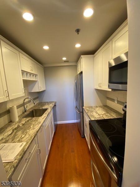 Interior, Kitchen, Recessed Lighting, Washer, Wood Texture Flooring