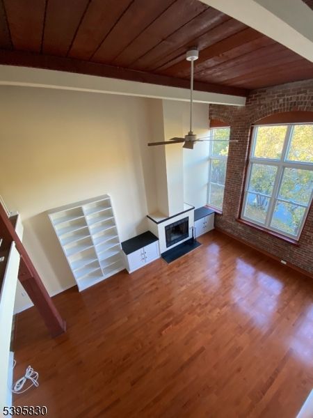 Empty room, Fireplace, Interior, Stone Walls, Wooden Ceilings, Wood Texture Flooring