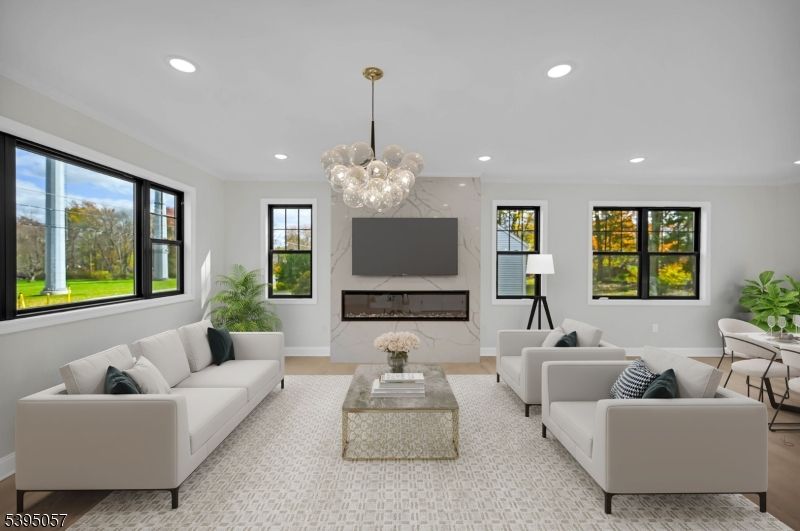 Fireplace, Interior, Living room, Marble Walls, Pendant Lights, Recessed Lighting, Wood Texture Flooring