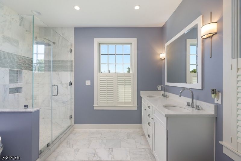 Bathroom, Dual Sink Vanities, Glass Shower, Interior, Marble, Marble Walls, Recessed Lighting