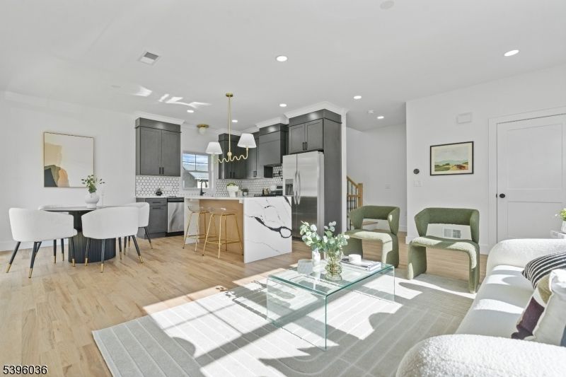 Dining room, Interior, Kitchen, Living room, Pendant Lights, Recessed Lighting, Stainless Steel Appliances, Wood Texture Flooring