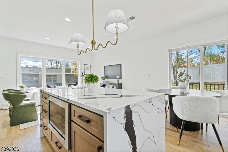 Chandelier, Dining room, Interior, Kitchen, Living room, Recessed Lighting, Wood Texture Flooring