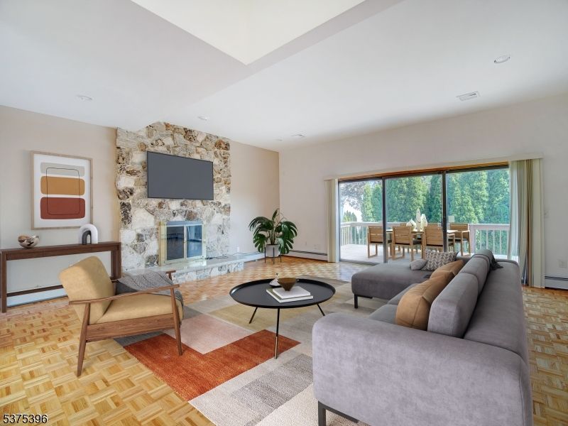 Dining room, Fireplace, Interior, Living room, Recessed Lighting, Stone Walls, Wood Texture Flooring