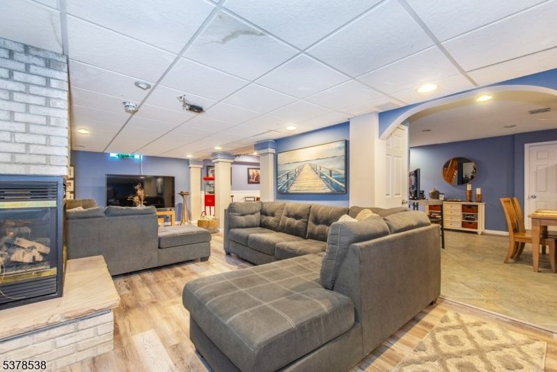 Dining room, Fireplace, Interior, Living room, Recessed Lighting, Wood Texture Flooring