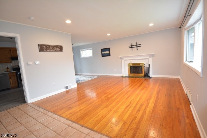 Empty room, Fireplace, Interior, Recessed Lighting, Wood Texture Flooring