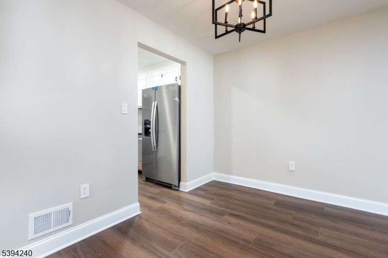 Chandelier, Empty room, Interior, Kitchen, Pendant Lights, Stainless Steel Appliances, Wood Texture Flooring