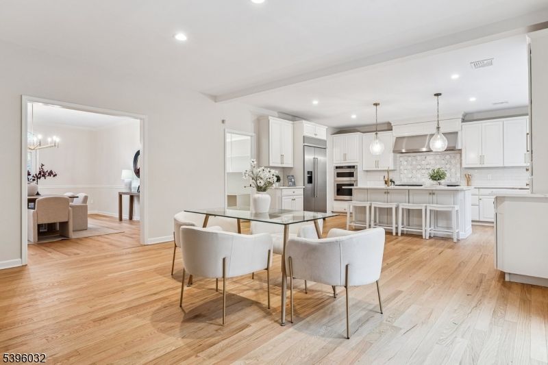 Dining room, Interior, Kitchen, Pendant Lights, Recessed Lighting, Stainless Steel Appliances, Wood Texture Flooring