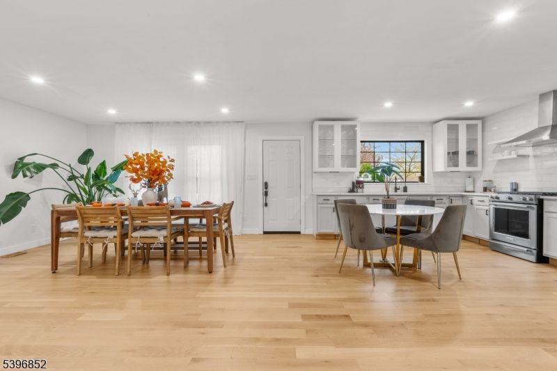 Dining room, Interior, Kitchen, Recessed Lighting, Stainless Steel Appliances, Wood Texture Flooring