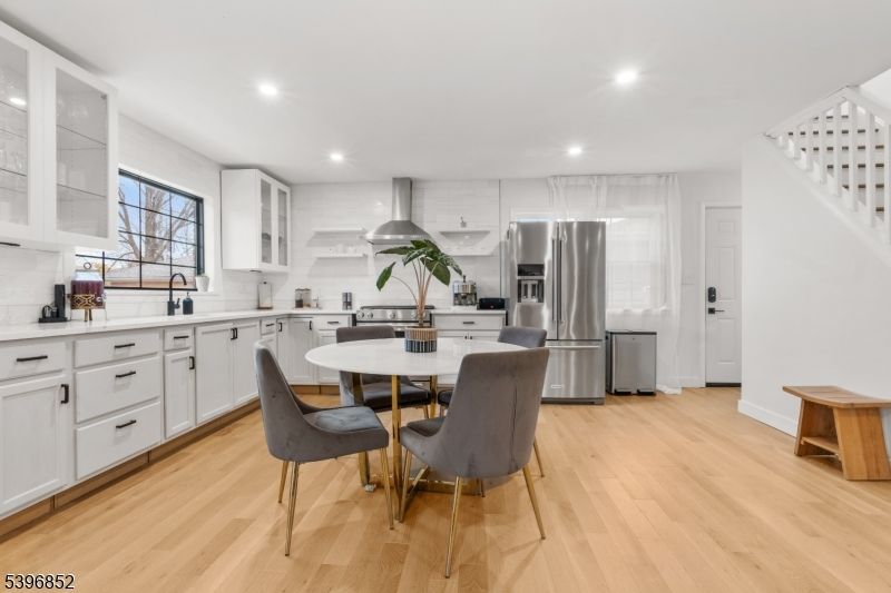 Dining room, Interior, Kitchen, Recessed Lighting, Stainless Steel Appliances, Wood Texture Flooring