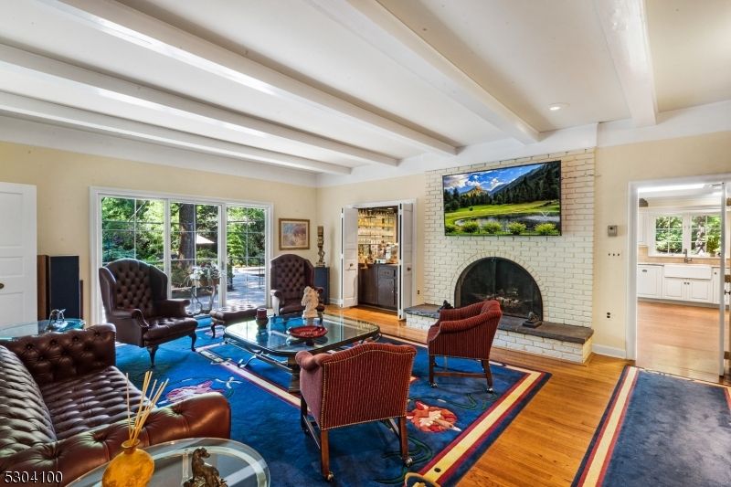 Fireplace, Interior, Living room, Recessed Lighting, Stone Walls, Wood Texture Flooring