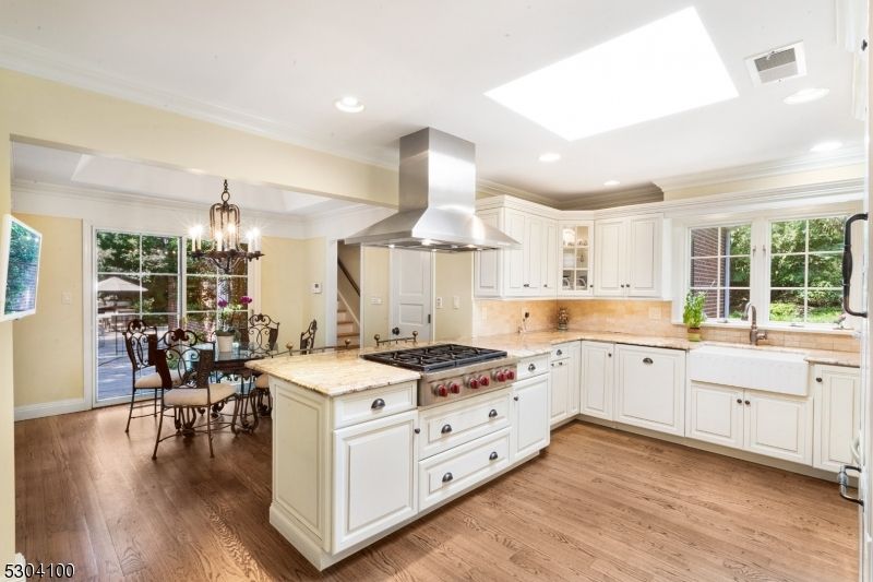 Chandelier, Dining room, Interior, Kitchen, Recessed Lighting, Stainless Steel Appliances, Wood Texture Flooring