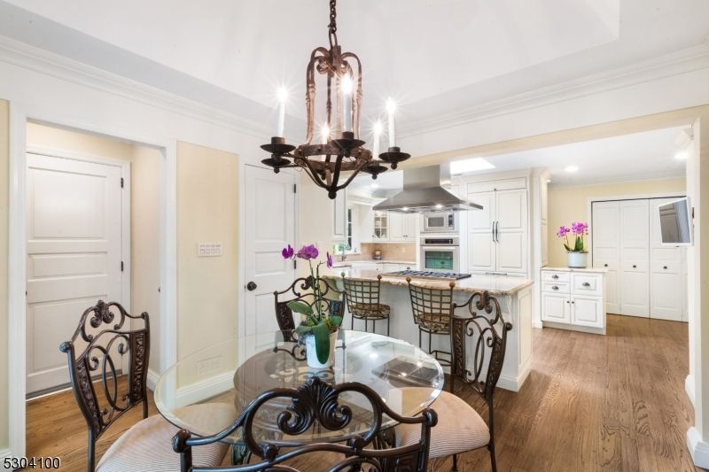 Chandelier, Dining room, Interior, Kitchen, Recessed Lighting, Stainless Steel Appliances, Wood Texture Flooring
