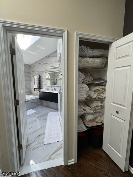 Bathroom, Free Standing Baths, Interior, Marble, Marble Walls, Walk-in Closets, Wood Texture Flooring