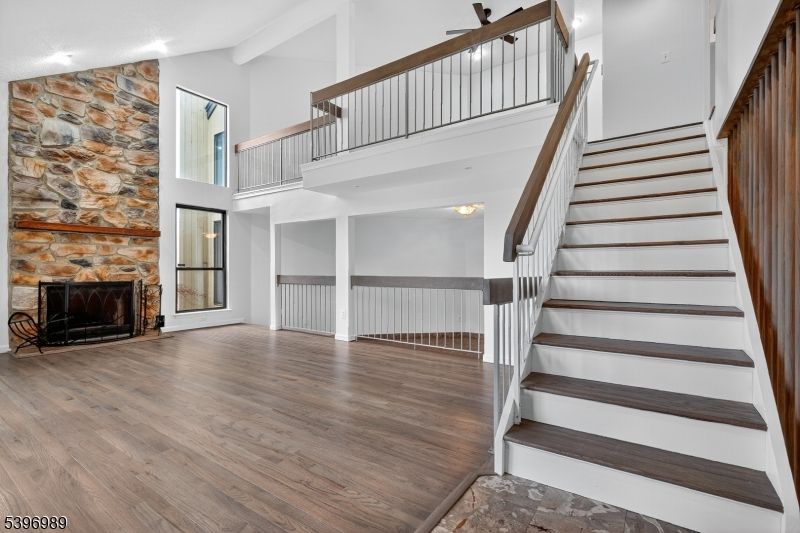 Fireplace, Interior, Recessed Lighting, Stone Walls, Wood Texture Flooring