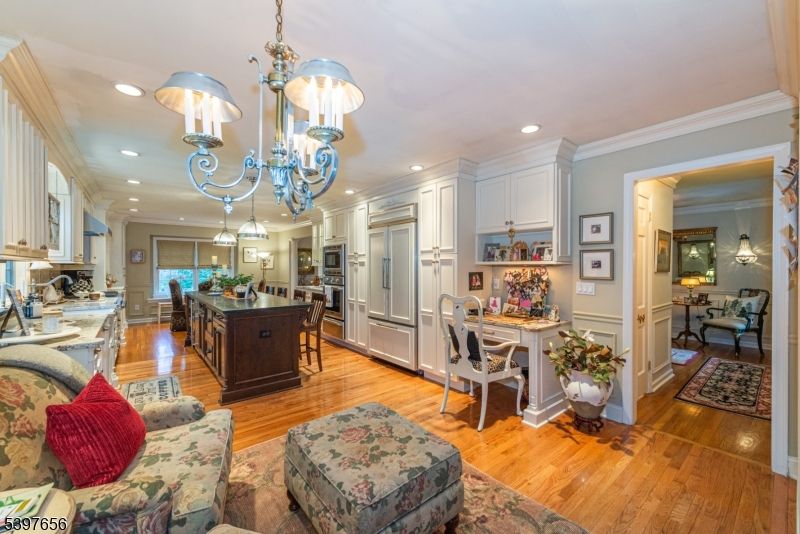 Chandelier, Dining room, Interior, Kitchen, Pendant Lights, Recessed Lighting, Stainless Steel Appliances, Wood Texture Flooring