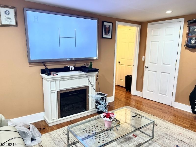 Fireplace, Interior, Living room, Recessed Lighting, Wood Texture Flooring