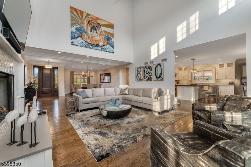 Chandelier, Interior, Kitchen, Living room, Pendant Lights, Recessed Lighting, Stainless Steel Appliances, Wood Texture Flooring