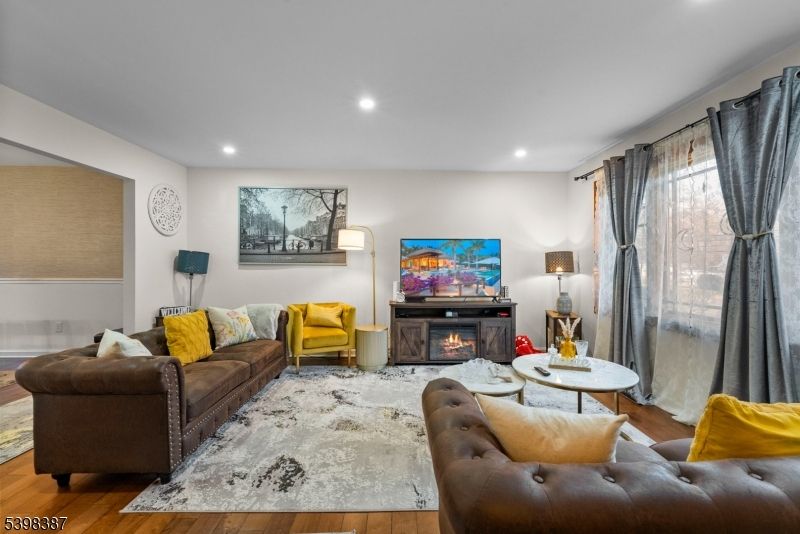 Fireplace, Interior, Living room, Recessed Lighting, Wood Texture Flooring