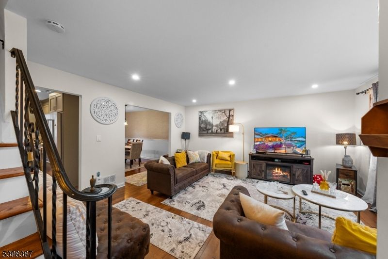 Fireplace, Interior, Living room, Recessed Lighting, Wood Texture Flooring