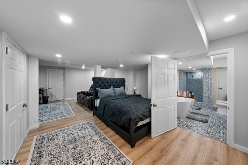 Bathroom, Bedroom, Glass Shower, Interior, Recessed Lighting, Wood Texture Flooring