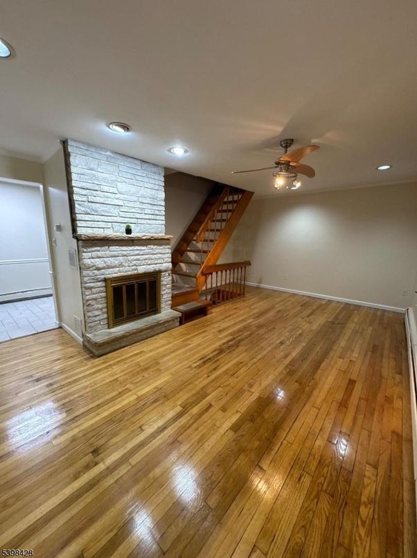 Empty room, Fireplace, Interior, Recessed Lighting, Wood Texture Flooring