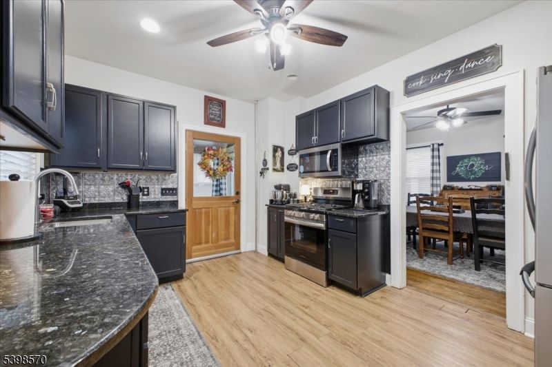 Dining room, Interior, Kitchen, Recessed Lighting, Stainless Steel Appliances, Wood Texture Flooring