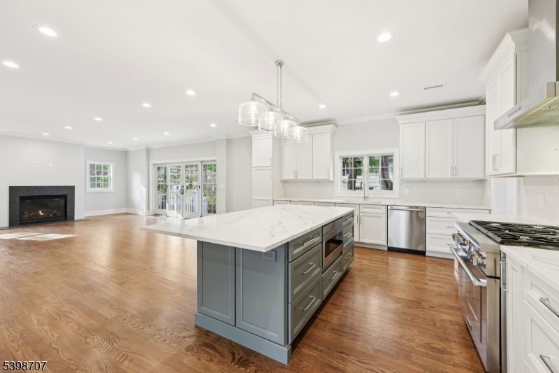 Fireplace, Interior, Kitchen, Pendant Lights, Recessed Lighting, Stainless Steel Appliances, Wood Texture Flooring