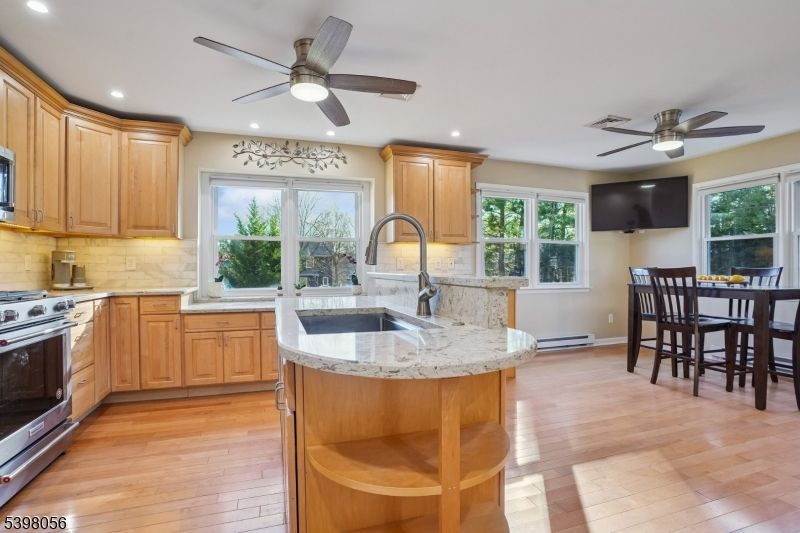 Dining room, Interior, Kitchen, Recessed Lighting, Stainless Steel Appliances, Wood Texture Flooring